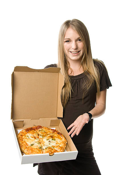 Woman holding a pizza stock photo