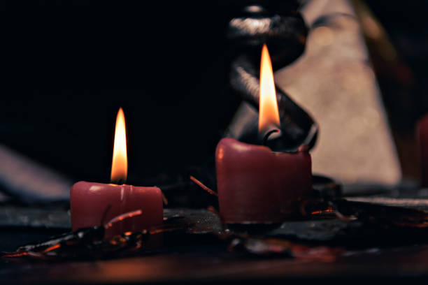 istock Witchcraft composition with candles, magic book and pentagram symbol. Altar for satanic rituals. Black magic and occult objects. 1443239558