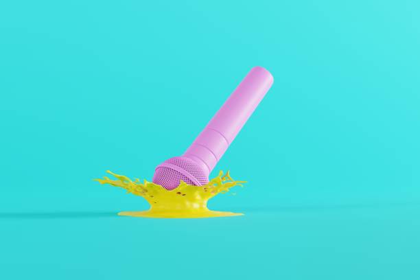 istock A microphone falling to the ground in a splash of water. 1443239638