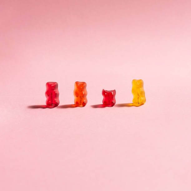 istock Colorful gummy bears on pink Background 1443239651