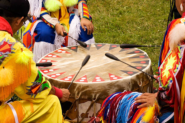 Indian Pow Wow Beating Drum at Indian Pow Wow  Teamwork Colorful regalia indigenous peoples of the americas stock pictures, royalty-free photos & images