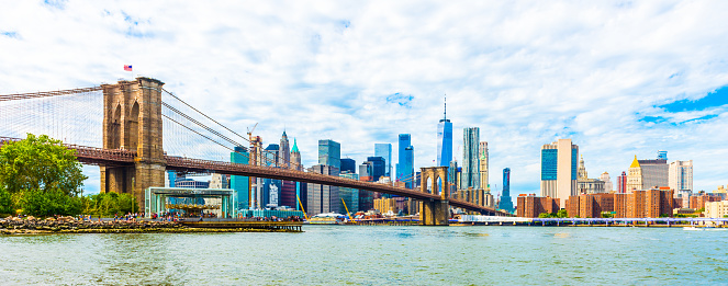 Brooklyn Bridge at sunset view. New York City, USA. Brooklyn Bridge is linking Lower Manhattan to Brooklyn.