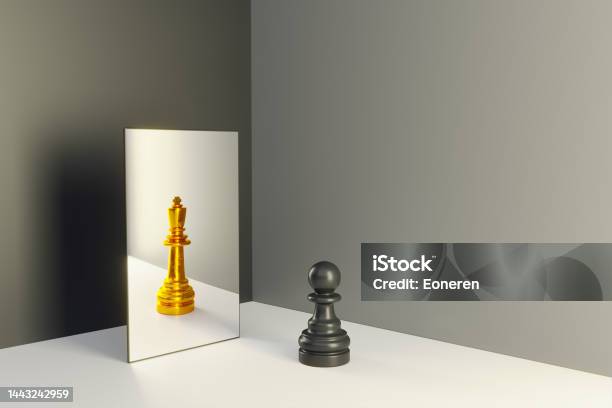 Chess Pawn In A Mirror Reflecting Himself As A King Stock Photo - Download Image Now