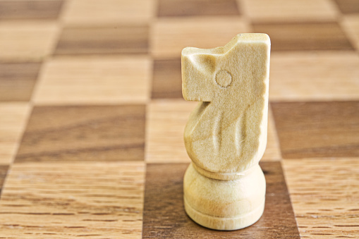 Chess piece on a wooden board