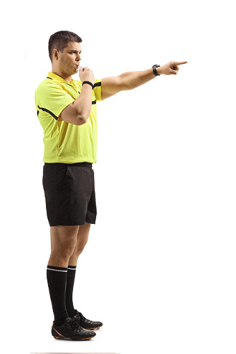 Referee showing the illegal use of hands signal.
