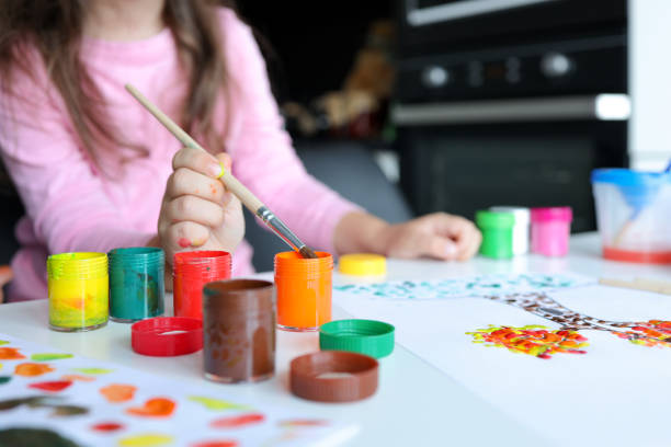 istock Child draw, paint on a brush. Children development concept. 1443243775