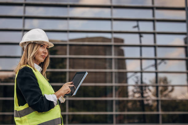 istock Senior construction engineer working on the construction site of an business center 1443244548