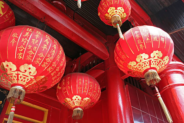 istock Red and gold Chinese lanterns hanging from temple 144324505