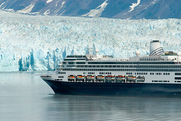 Alaskan cruise ship drifting near a glacier stock photo