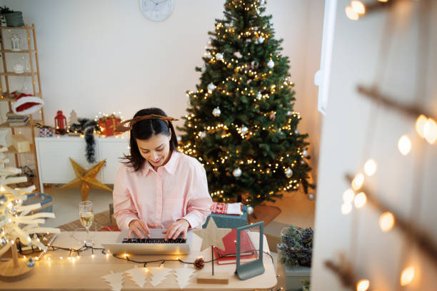 istock Young beautiful woman working from home during Christmas 1443245470