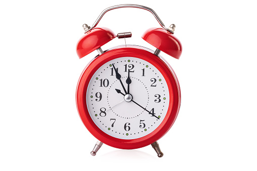 Red alarm clock isolated on white background with clipping path