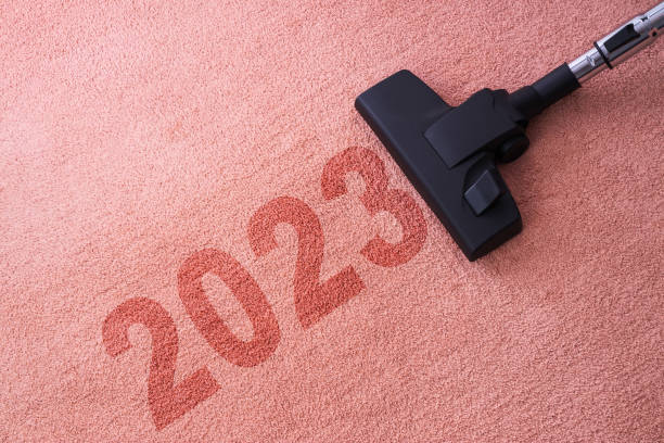 istock 2023 New year home cleaning with vacuum cleaner and copy space for a text 1443246383