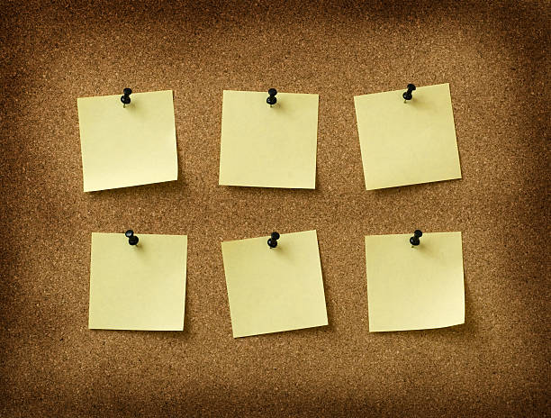 istock six yellow notes pinned to grunge cork background 144324685