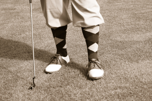 Brockton, MA, USA-June 8, 2015: A golfer works on his chipping at a golf course practice range on a late spring day.