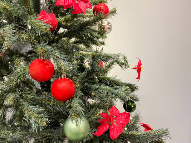 istock Christmas tree on the gray background with copy spaceChristmas tree on the gray background with copy space. Christmas decoration 1443251058