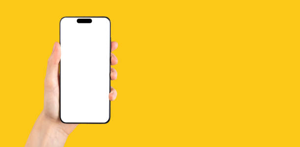 istock Phone mock up frame in hand on yellow ad banner, promo background for app ads 1443252066