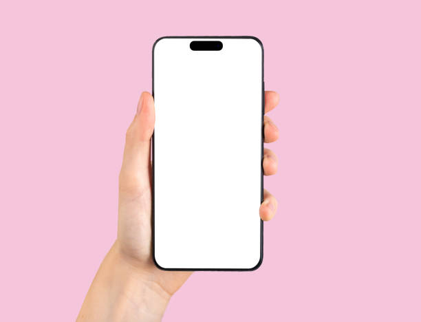 istock Mobile phone, smartphone mockup, screen display mock up in hand, POV on pink 1443252068