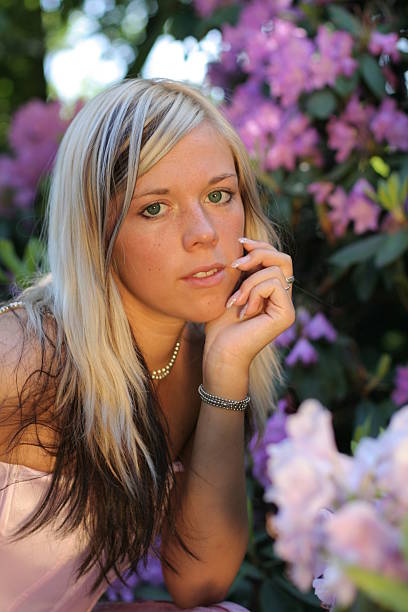 istock Young girl with flowers 144325211
