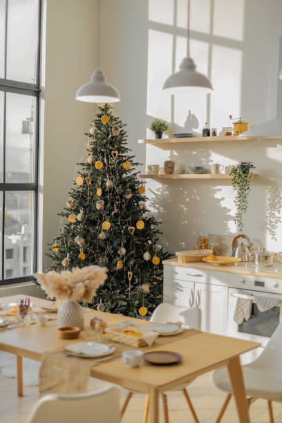 istock spacious white dining room in a modern minimalist design with a suspended bed. decorated with Christmas decorations and a Christmas tree 1443253303