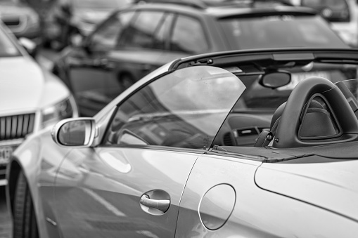 Hamburg, Germany - October 23. 2022: Close-up of the parked Mercedes SLK, model r171, open cabriolet in Hamburg. Image developed as a black and white photo