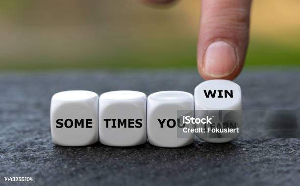 Dice Form The Expression Sometimes You Win And Sometimes You Learn Stock Photo - Download Image Now