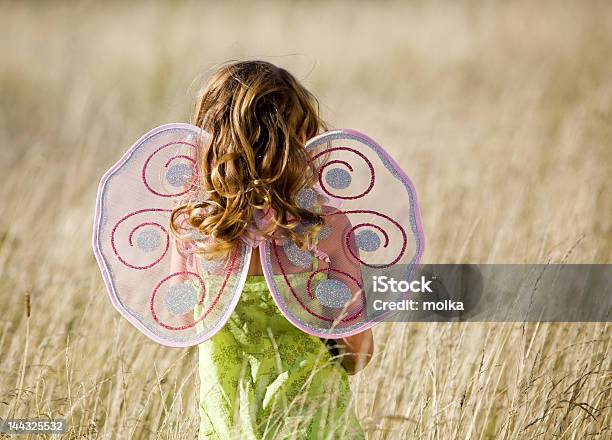 A Little Girl In A Field Wearing Butterfly Wings Stock Photo - Download Image Now - Butterfly - Insect, Child, Costume Wing