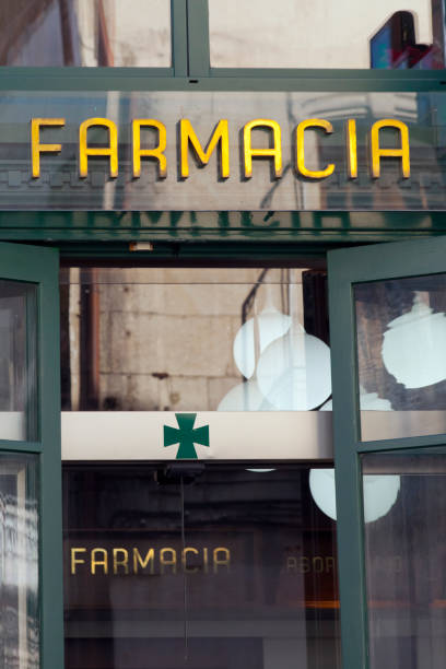 istock Pharmacy sign,  open door, green cross. 1443256013