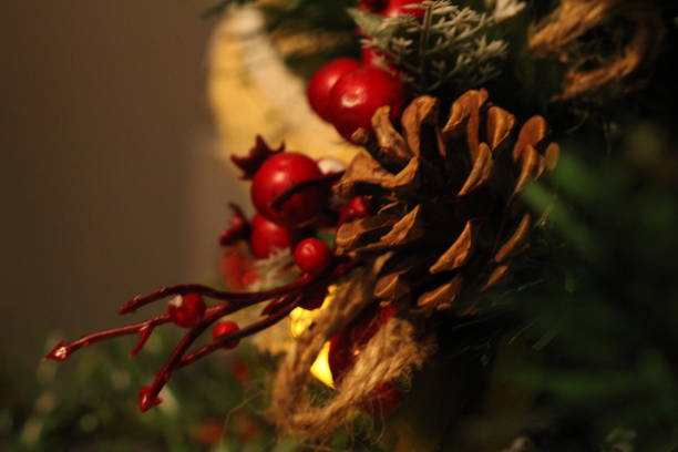 istock Pine Cone Stuck in a Christmas Ornament 1443256096