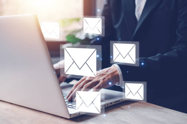 istock Businessman hands typing notebook (Laptop) with email icon and send e-mail or newsletter. Electronic mail marketing and online working internet network concept. 1443256328