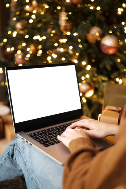 istock woman work on laptop computer with blank display screen with mockup copy space. Concept of online shopping, discounts or online communication at a distance 1443257160
