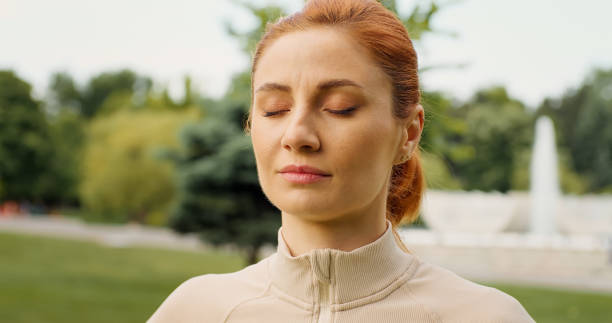 istock Female practicing breathing exercises. Relaxing and meditation practices. 1443257176