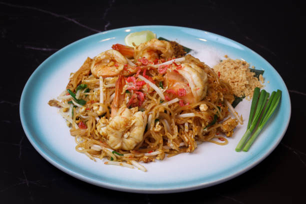 istock A Plate of “Phad Thai” with prawn on table with green Chinese chive, ground nuts 1443263762