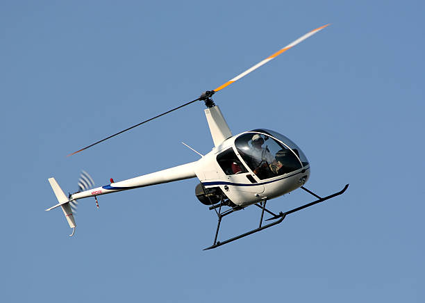 istock Two person helicopter flying in the sky 144326420