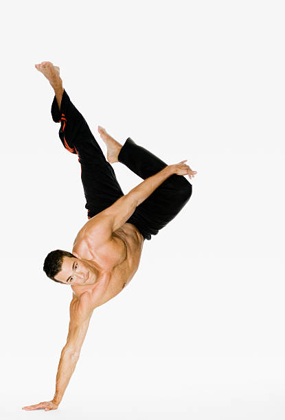 istock young man demonstrating hand stand 144326423
