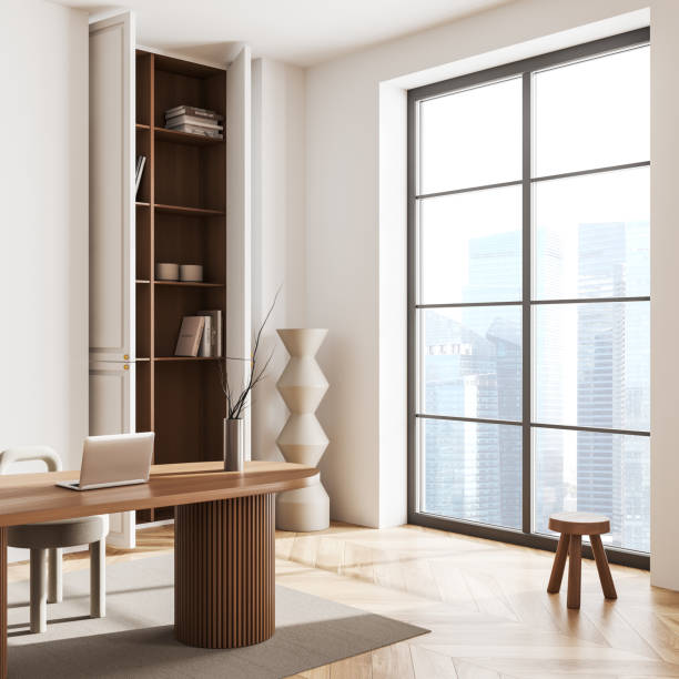 istock Stylish office room interior with desk and computer, panoramic window 1443267130