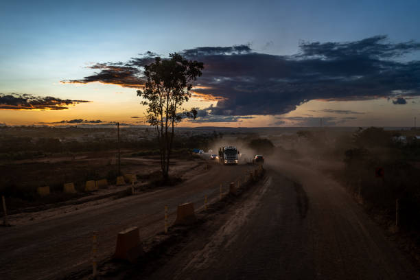 istock sunset over the road with cars 1443267342