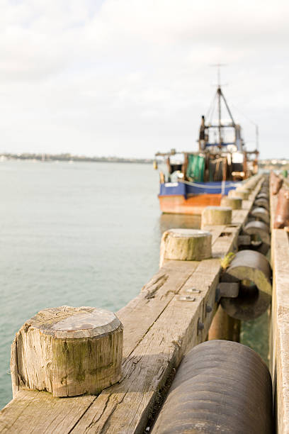 istock Dock with fishing boat 144326761
