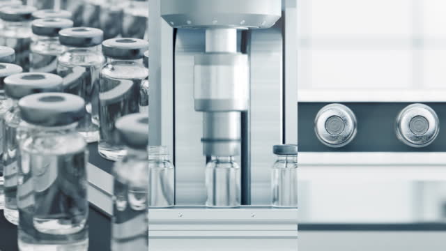 Video montage of medicine vials on a production line in a pharmaceutical factory