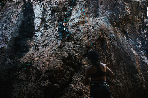 Teamwork outdoors and enjoy rock climbing challenges