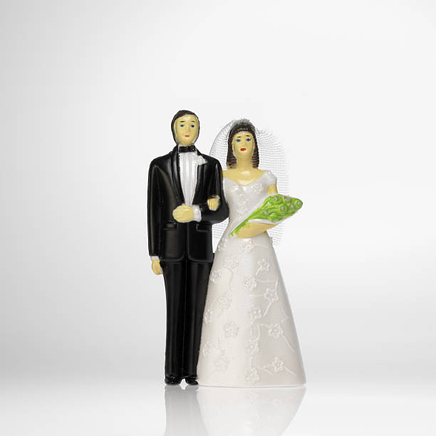 istock bride and groom cake topper 144327007