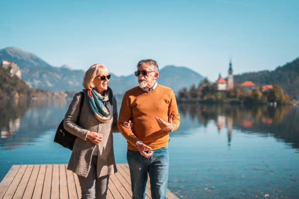 istock Elegant Senior Couple Strolling at  Lake Bled 1443270943