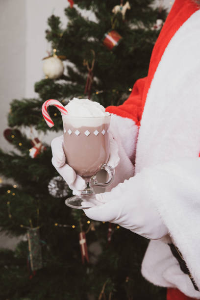 istock Santa Claus with hot chocolate drink 1443270950