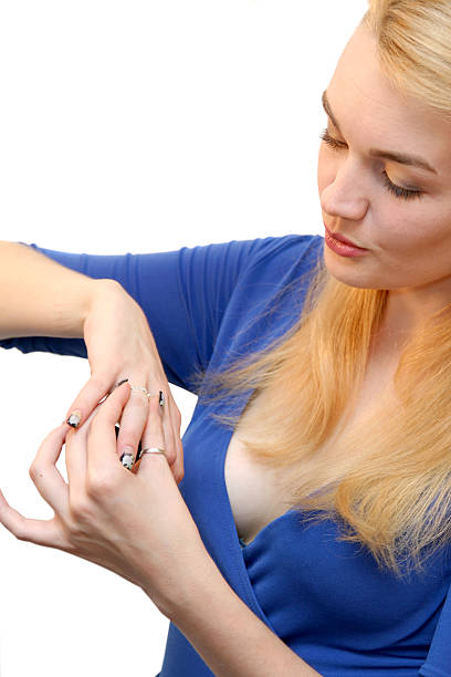 blond woman and ring on hand stock photo