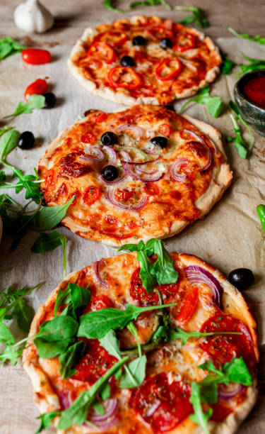 istock Rustic homemade pizza on wooden base 1443278104
