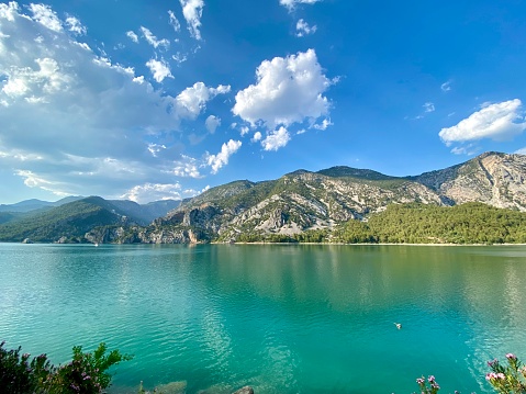 View of a lake with clear invigorating water surrounded by green mountains National park Green canyon The largest artificial water reservoir in Turkey 350 meters above sea level. High quality photo