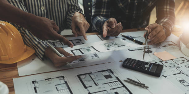 istock Engineer Teamwork Meeting, Drawing working on blueprint meeting for project working with partner on model building and engineering tools in working site, Construction and structure concept. 1443282930