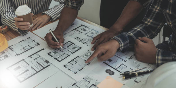 istock Engineer Teamwork Meeting, Drawing working on blueprint meeting for project working with partner on model building and engineering tools in working site, Construction and structure concept. 1443283316