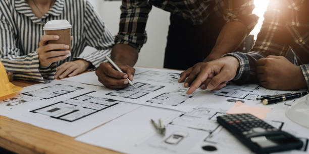 istock Engineer Teamwork Meeting, Drawing working on blueprint meeting for project working with partner on model building and engineering tools in working site, Construction and structure concept. 1443283372