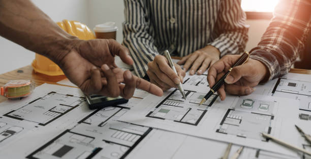 istock Engineer Teamwork Meeting, Drawing working on blueprint meeting for project working with partner on model building and engineering tools in working site, Construction and structure concept. 1443283423