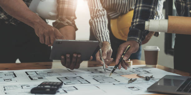 istock Engineer Teamwork Meeting, Drawing working on blueprint meeting for project working with partner on model building and engineering tools in working site, Construction and structure concept. 1443283451